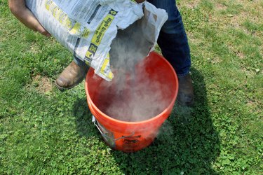 pour 1/2 bag of concrete into bucket