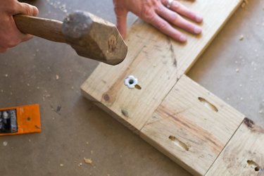 Secure T nut in place with a hammer.