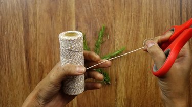 Cutting string for Christmas wreath gift tags.