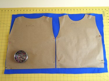The two templates pinned to blue felt.