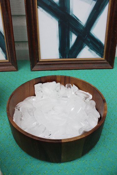 Fill the bottom of the bowl with ice.