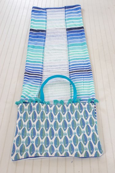 folding in the sides of the towel