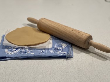 Rolled cookie dough with rolling pin.