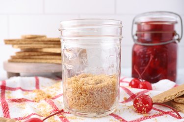 graham cracker crust in a Mason jar
