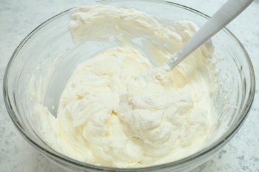 mixing the cheesecake filling and whipped cream
