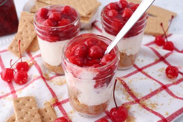 group of three cherry cheesecake jars