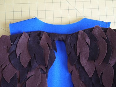 The wings attached to the back of the vest.