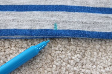 Mark the center of the bottom of the dress.