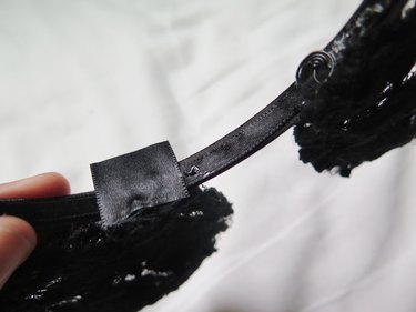 Ribbon pressed onto the bottom of the headband to conceal the coil.