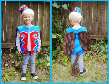 A toddler in a felt monkey costume, front and back.