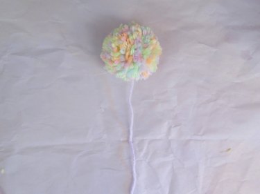 A finished yarn pompom