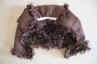 Elastic sewn to the front of the hood.