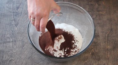 Combining dry ingredients for pumpkin spice latte muffins.