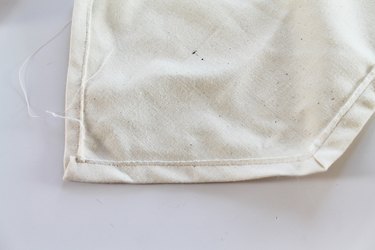Sewing edges of flag