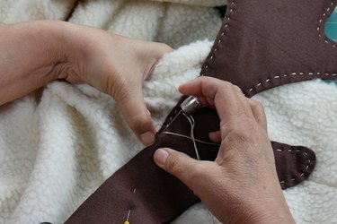Stitch antlers to sherpa fleece.