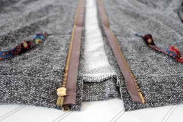 turn zipper over, place along raw edge