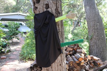 The cape is now attached to the tree