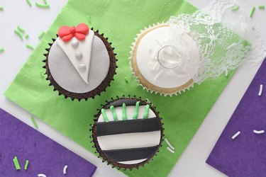 Three different Beetlejuice-themed cupcakes