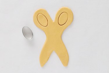Cut out ovals in scissors' handles