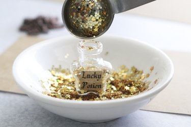 Adding gold glitter to star bottle pendant