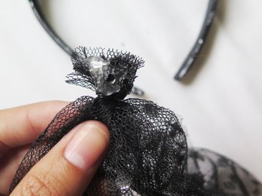 Hot glue applied to the scrunched lace veil.
