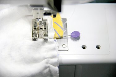 Sewing the ruffle onto the skirt