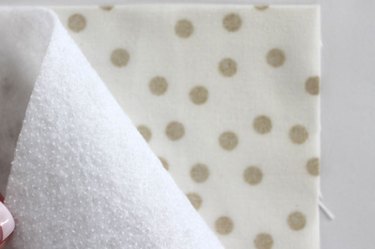 Place fusible fleece on wrong side of fabric.