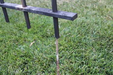 Using rebar to keep the fence in place.