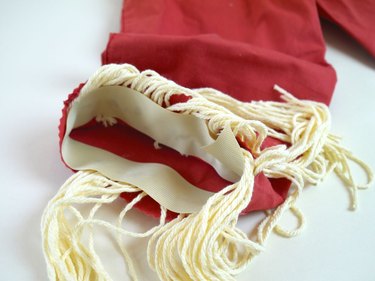 The pant cuff with the yarn straw coming out.