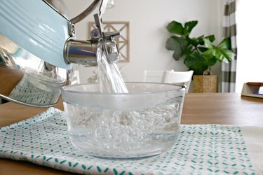 Pouring hot water into a bowl