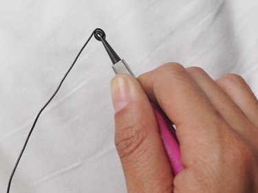 Creating a coil with the end of the wire.