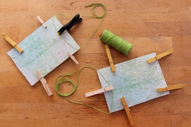 The back side of the sun-catchers showing the string attachments to hang the art