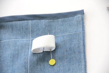 Pin opposite side of elastic in place