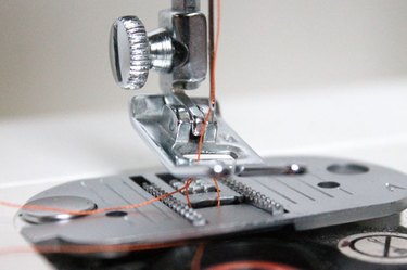Bobbin thread looped over the needle thread.