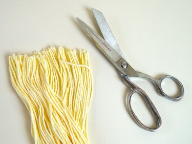The trimmed ribbon and a pair of scissors.