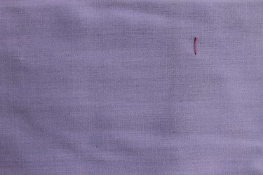 Inserting the needle to make the first part of the zig zag stitch