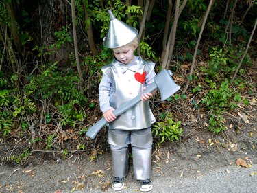 little boy dressed in tin man costume