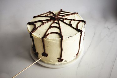 Use a wooden skewer to form the chocolate hazelnut spread into little spiders.