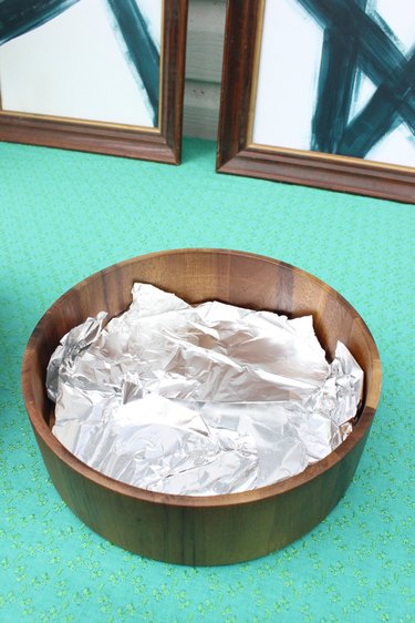 Cover the bottom of the bowl in aluminum foil.
