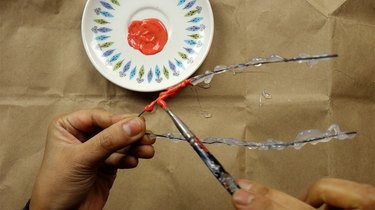 Painting DIY faux coral sculpture.