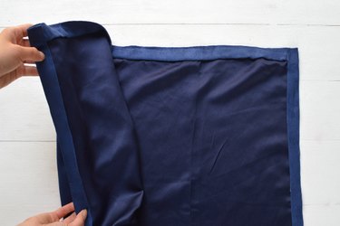 Make a finished hem on three sides of the suede