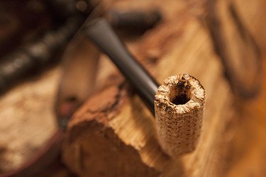 Place the stem inside the hole you drilled on the side of the cob.
