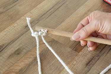 attach long cord to same screw eye