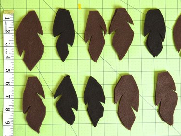 Two rows of brown feathers cut 5-inches long and 3-inches wide.