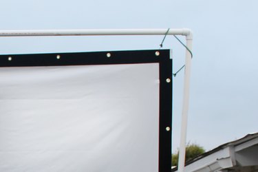 Hanging the screen material.