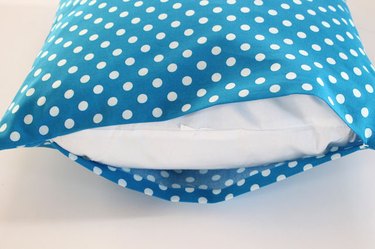 slide the pillow into the pillow case