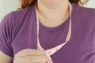 Using measuring tape to measure the cowl circumference.