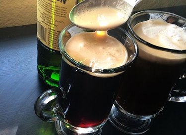 Glasses of Irish coffee with freshly whipped cream.