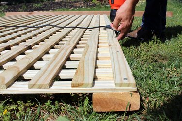 drill 2" deck screws into lattice and cedar board, top and bottom