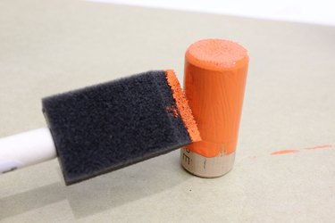 painting a cork for the clay pot snowman's nose